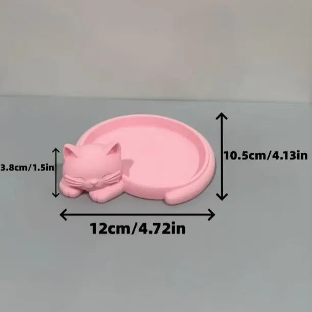 Pink cat desktop storage tray for jewelry (earrings, rings, necklaces, bracelets), keys, and a red sticky note holder.