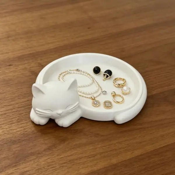 Pink cat desktop storage tray for jewelry (earrings, rings, necklaces, bracelets), keys, and a red sticky note holder.