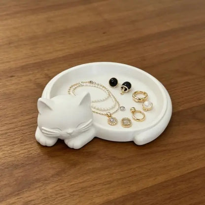 Pink cat desktop storage tray for jewelry (earrings, rings, necklaces, bracelets), keys, and a red sticky note holder.