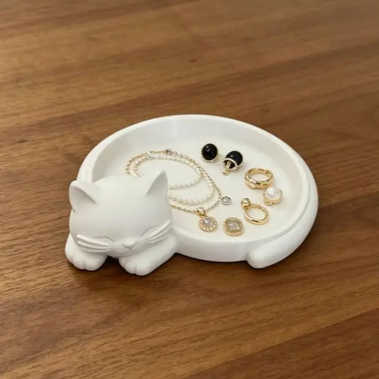 Pink cat desktop storage tray for jewelry (earrings, rings, necklaces, bracelets), keys, and a red sticky note holder.